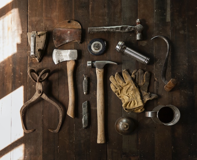 various tools displayed on a wooden table